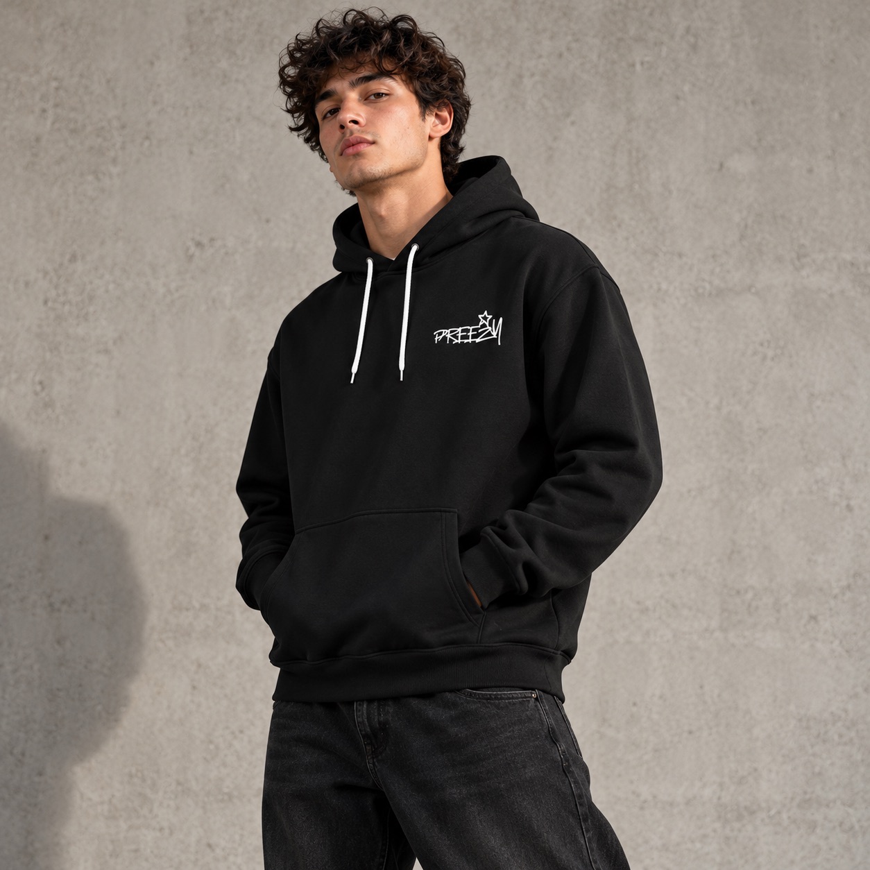 Model wearing the black Independence hoodie with small Preezy chest logo